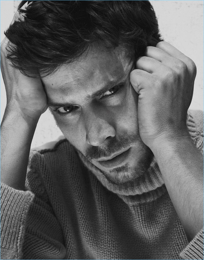 Ready for his close-up, François Arnaud sports a Stella McCartney sweater.