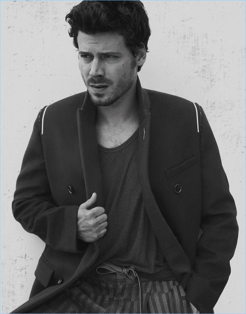 Connecting with Interview magazine, François Arnaud wears a Dior Homme coat with a T by Alexander Wang tank and Ermenegildo Zegna trousers.