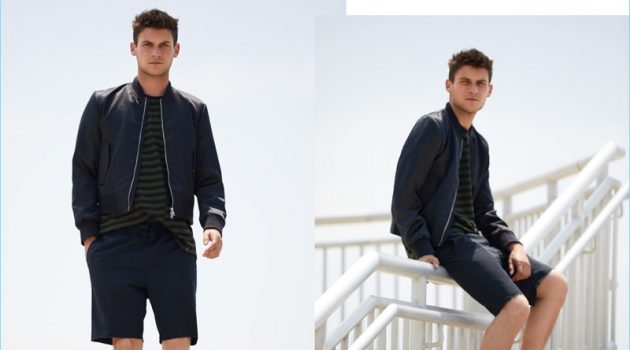 East Dane Spotlights 4 Ways to Wear Shorts Layering for brisk weather, Miles Garber wears a MKI souvenir jacket $131.60 and Rag & Bone striped tee $125. RVCA shorts $45 and Kenzo sneakers $215.20 complete his look.
