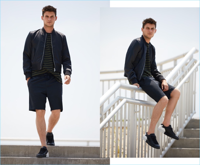 Layering for brisk weather, Miles Garber wears a MKI souvenir jacket $131.60 and Rag & Bone striped tee $125. RVCA shorts $45 and Kenzo sneakers $215.20 complete his look.