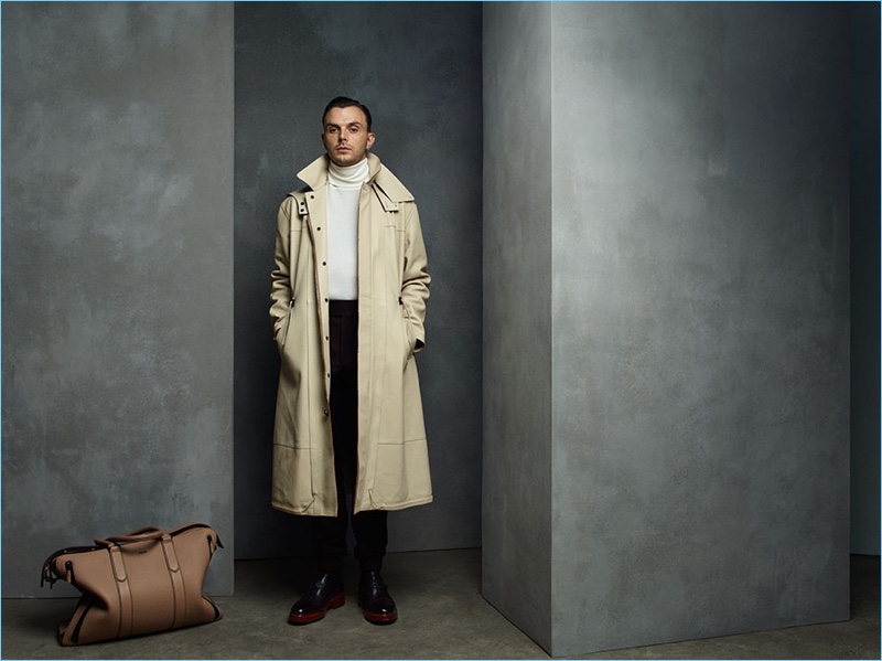 Donning a trench, Theo Hutchcraft makes a sleek statement in Ermenegildo Zegna Couture.