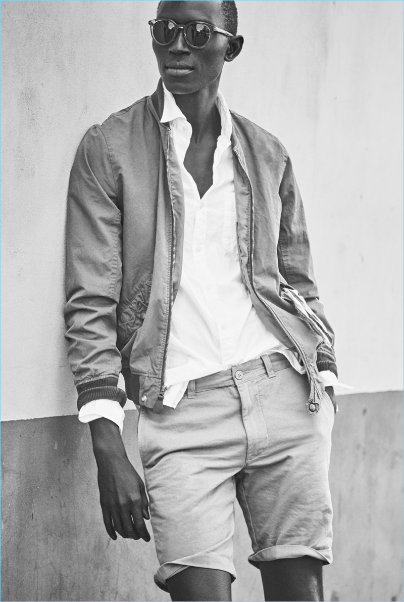 Play it cool in this city look by J.Crew. Model Armando Cabral wears a Wallace & Barnes MA-1 bomber jacket $148 with a J.Crew white shirt $59.50 and 9" shorts $64.50.