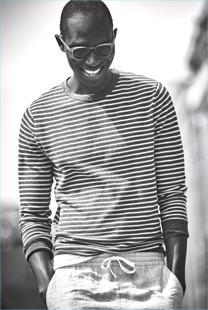 All smiles, Armando Cabral showcases effortless layering with a J.Crew striped sweater $59.50 and broken-in t-shirt $24.50.