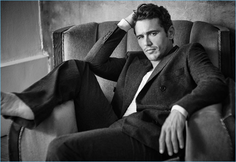 Appearing in a black and white photo, James Franco wears a Hermès suit with a Tom Ford sweater.