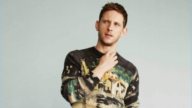 Actor Jamie Bell dons a Prada sweater with Dries Van Noten trousers.