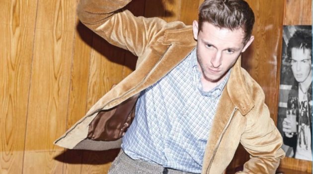 Safe for Work: Jamie Bell Sports Office-Ready Styles for Men's Health UK Playing a game, Jamie Bell sports a jacket, shirt, and trousers by Prada.