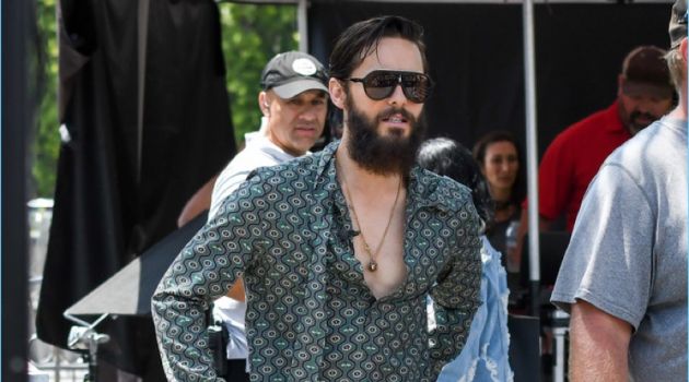 August 2017: Jared Leto visits the set of Extra. Leto sports a Gucci shirt and pants with Vans sneakers.
