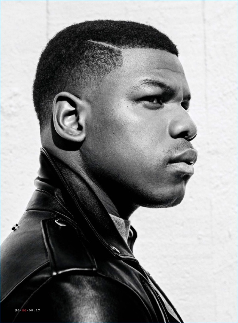 Delivering a side profile, John Boyega wears a Coach 1941 leather jacket with a Salvatore Ferragamo turtleneck.