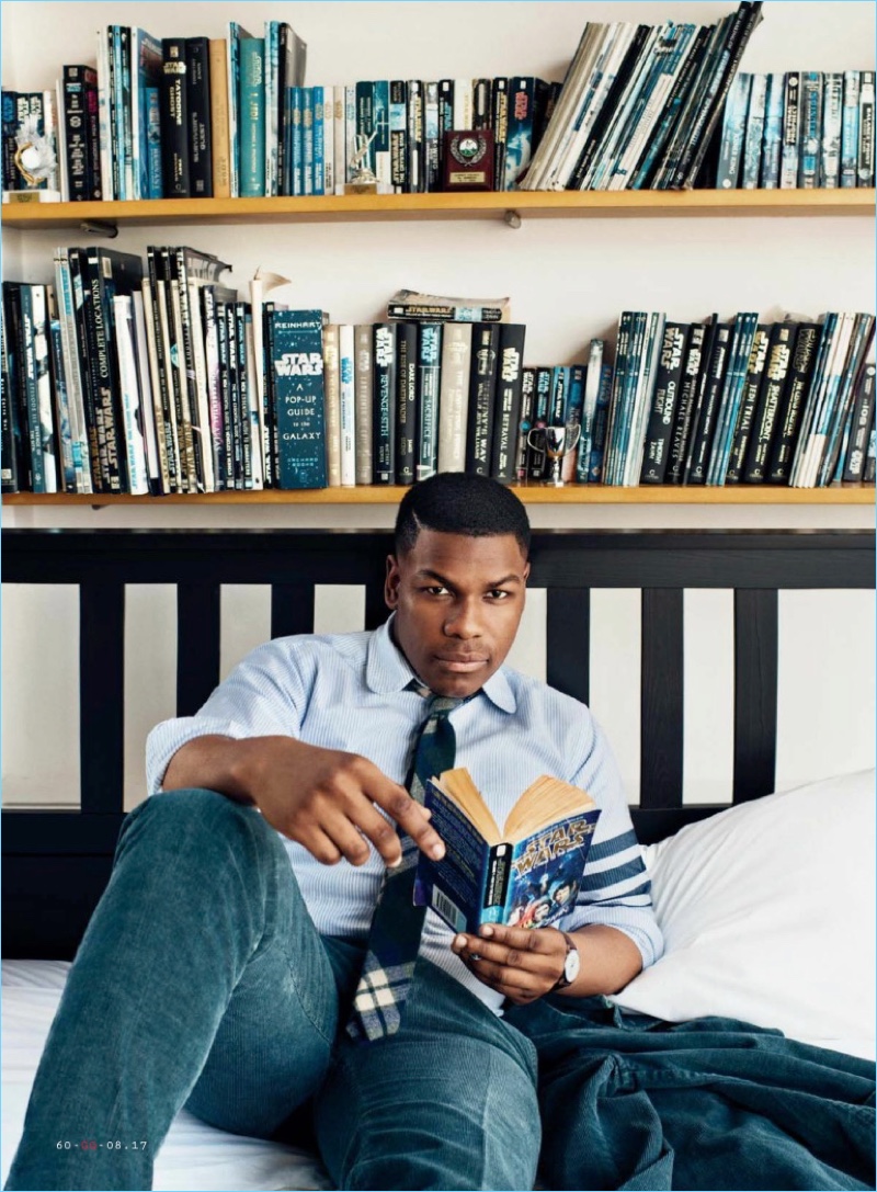 Relaxing, John Boyega sports a Kidos suit with a Thom Browne shirt and Alexander Olch tie.