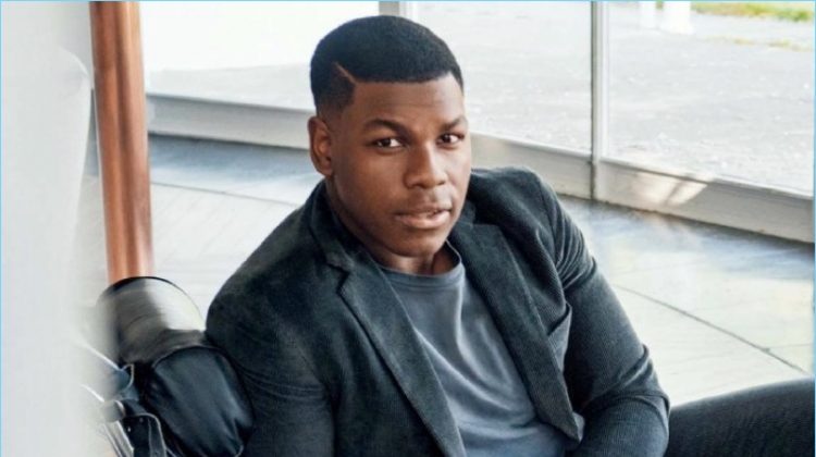 Connecting with GQ, John Boyega wears a Ralph Laurent suit jacket and pants with a POLO Ralph Lauren t-shirt and Tom Ford sneakers.