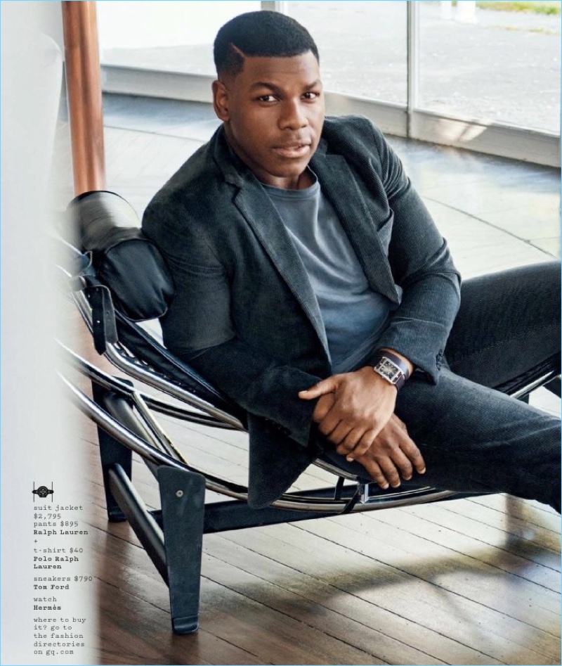 Connecting with GQ, John Boyega wears a Ralph Laurent suit jacket and pants with a POLO Ralph Lauren t-shirt and Tom Ford sneakers.