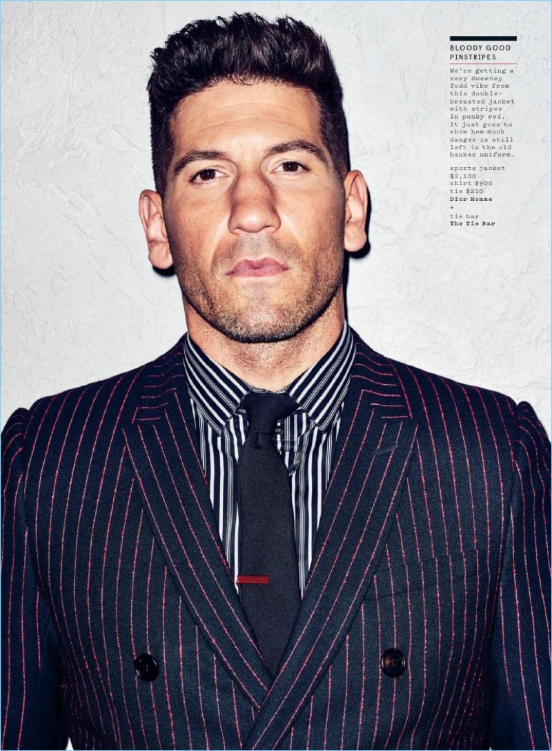 Suiting up, Jon Bernthal dons a Dior Homme pinstripe spots jacket with a striped shirt and tie.