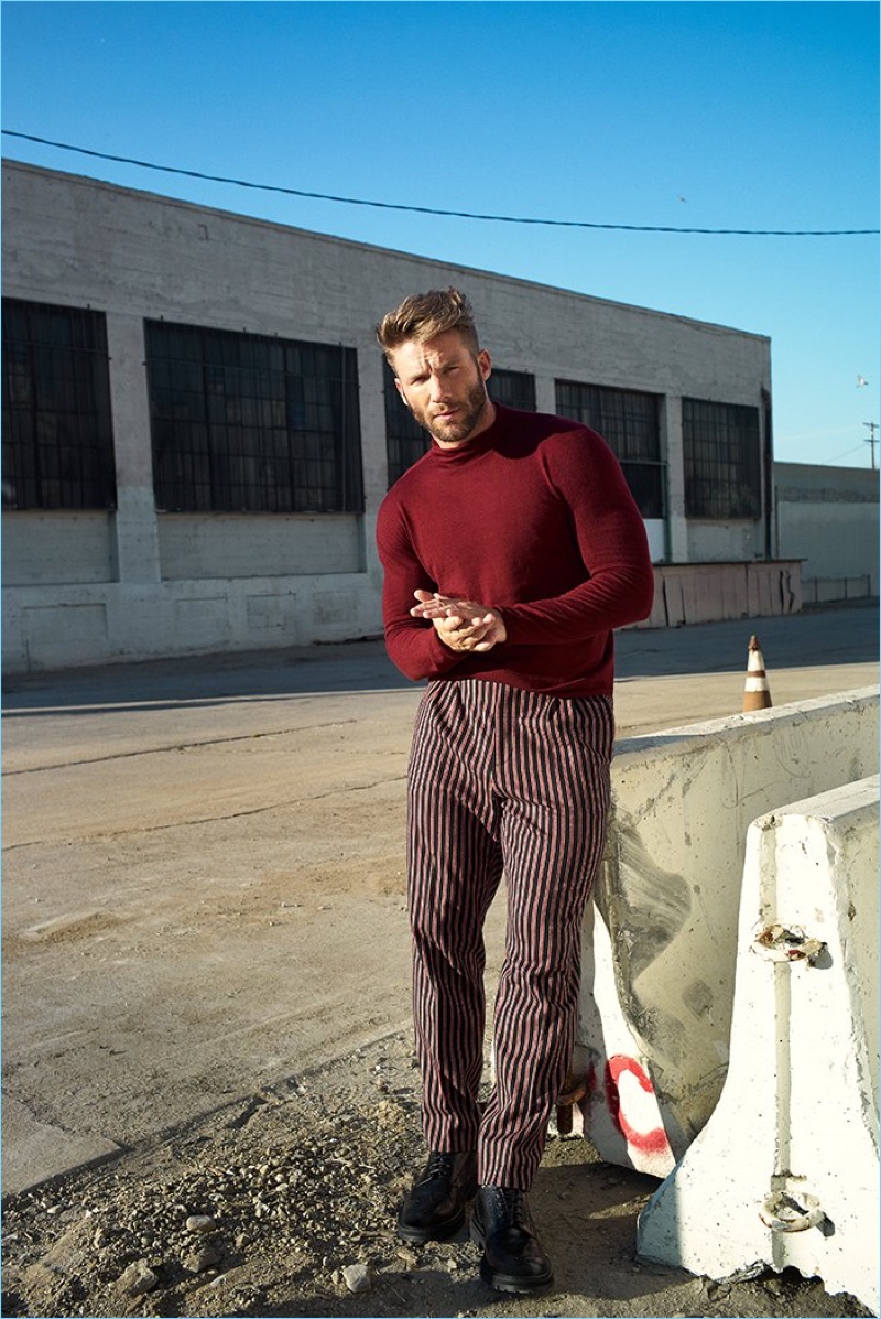 Making a case for red, Julian Edelman wears a Giorgio Armani sweater, Gucci trousers, and Dries Van Noten wingtip brogues.