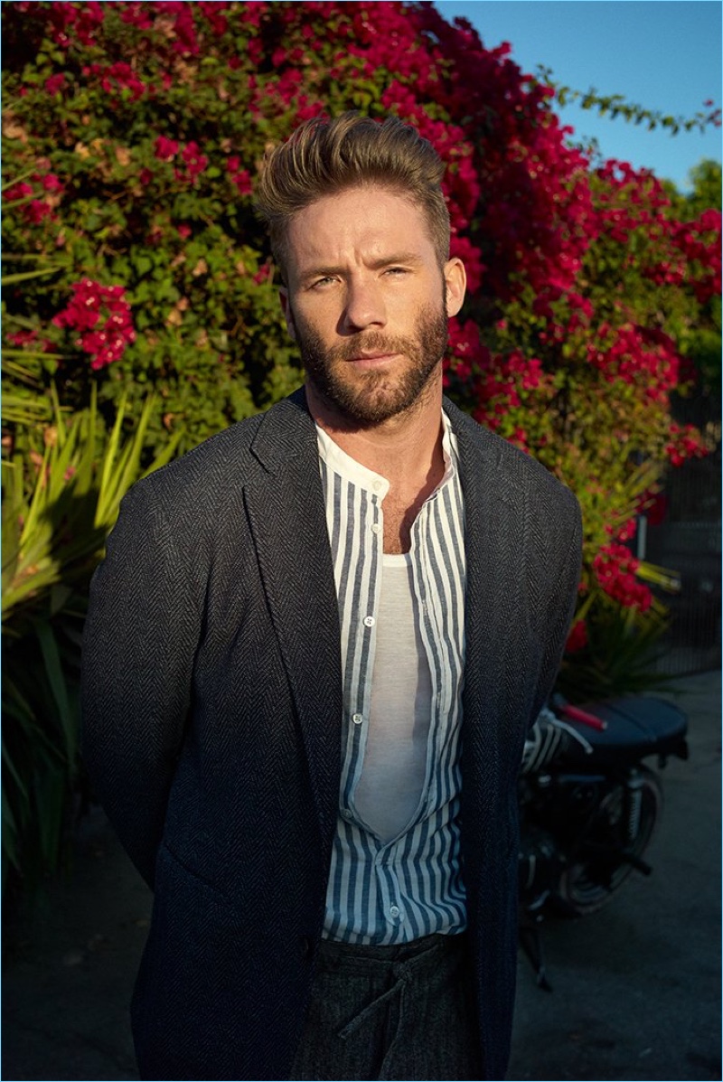 Connecting with Mr Porter, Julian Edelman dons a Giorgio Armani suit jacket, Massimo Alba shirt, Zimmerli tank, and Incotex drawstring trousers.
