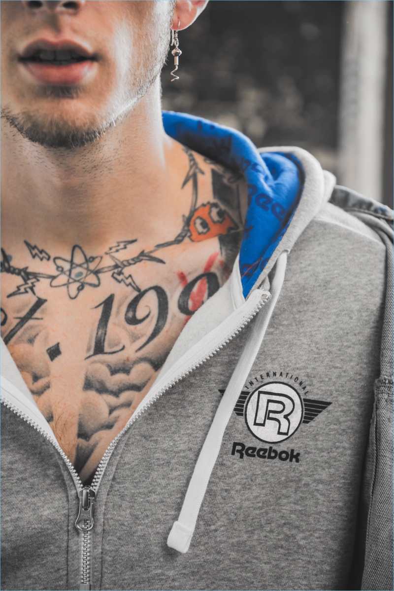 Reebok celebrates its Club C sneakers with the release of a nineties style half-zip hoodie.