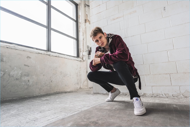 Rapper Machine Gun Kelly is front and center for Reebok's Club C Overbranded campaign.