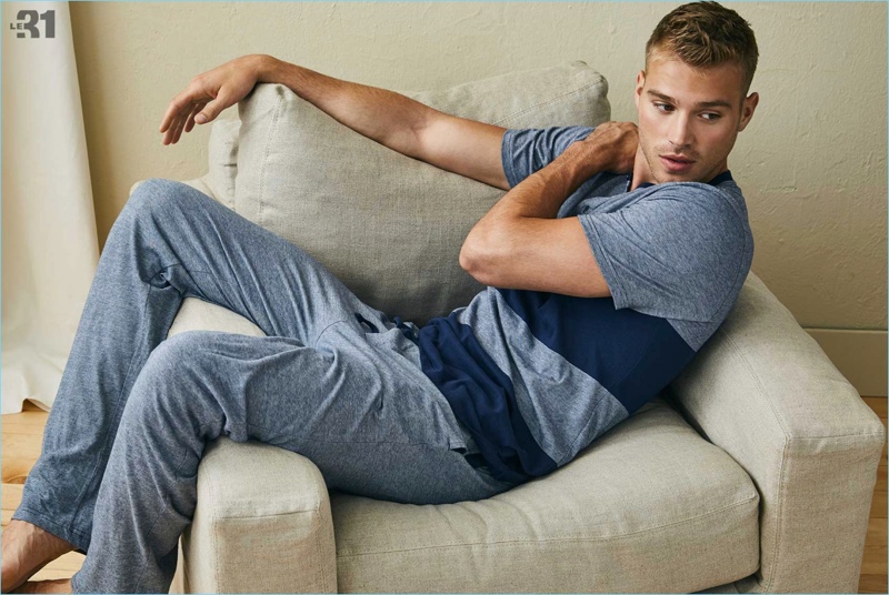 Posing for a relaxed image, Matthew Noszka wears loungewear from Simons.