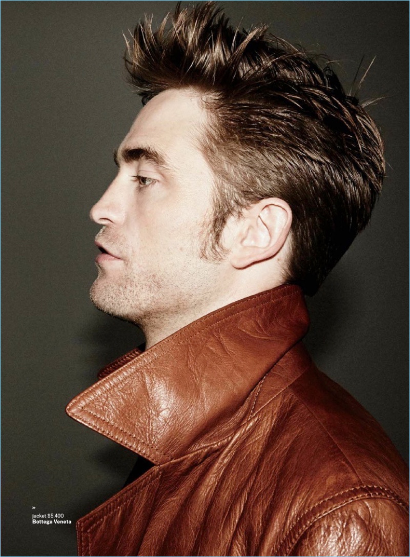 Delivering a side profile, Robert Pattinson dons a Bottega Veneta leather jacket.