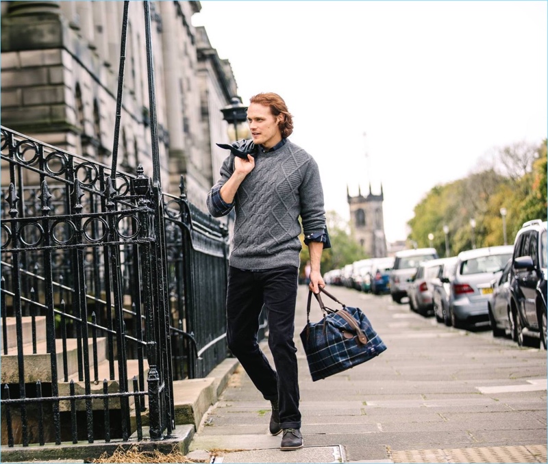 Going for a stroll, Sam Heughan reunites with Barbour for fall-winter 2017.