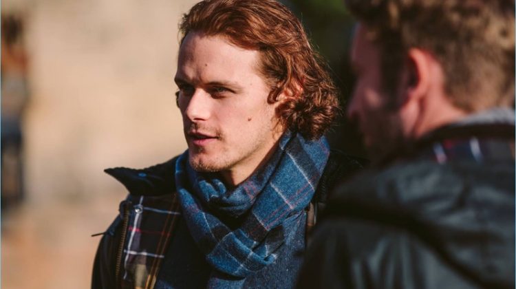 Reuniting with Barbour, Sam Heughan sports tartan fashions from the brand's fall-winter 2017 collection.