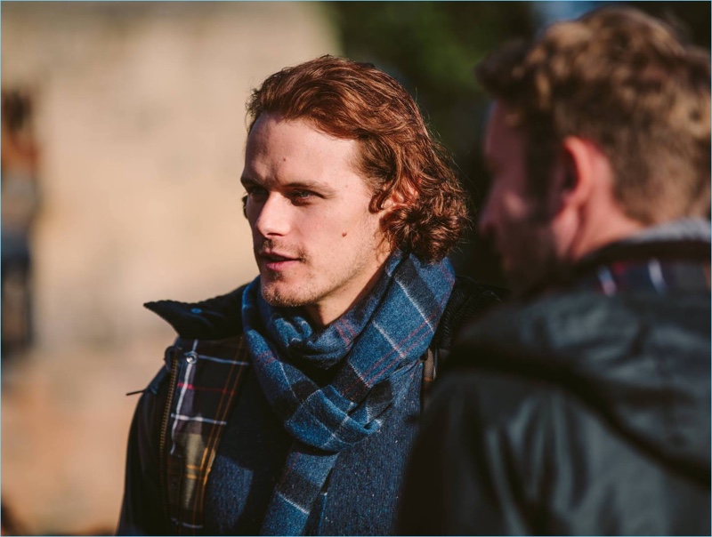 Reuniting with Barbour, Sam Heughan sports tartan  fashions from the brand's fall-winter 2017 collection.