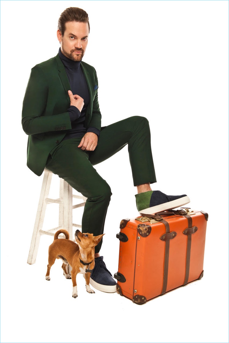 Making a green statement, Shane West wears a trim Paul Smith suit with a Vince Camuto turtleneck and Ports 1961 sneakers.