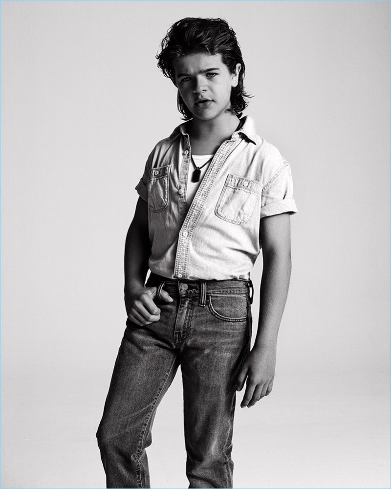 Gaten Matarazzo sports a Gap shirt with Levi's jeans and a Dolce & Gabbana tank.