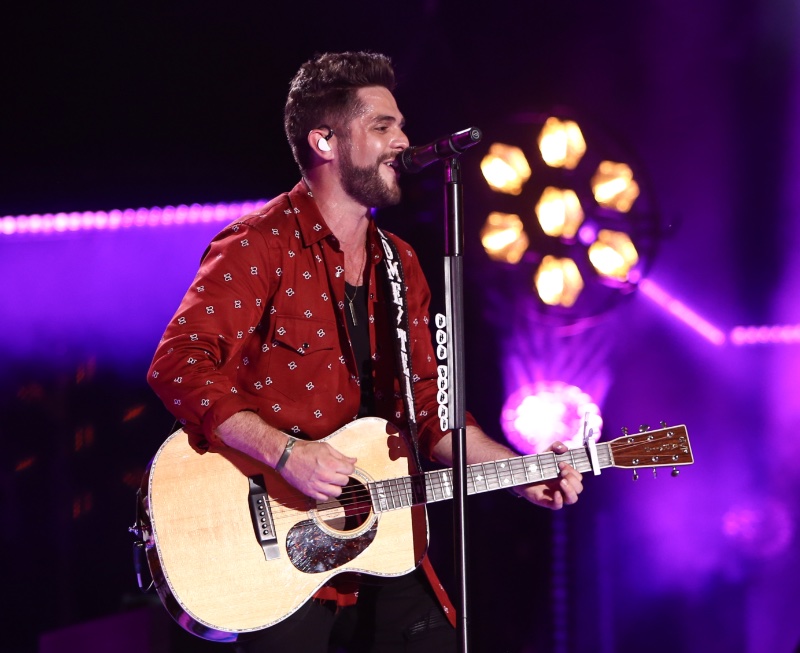 Country star Thomas Rhett wears a red patterned western shirt with snap buttons as he performs. » Western Shirts: From Rodeos to the Catwalk Country star Thomas Rhett wears a red patterned western shirt with snap buttons as he performs.