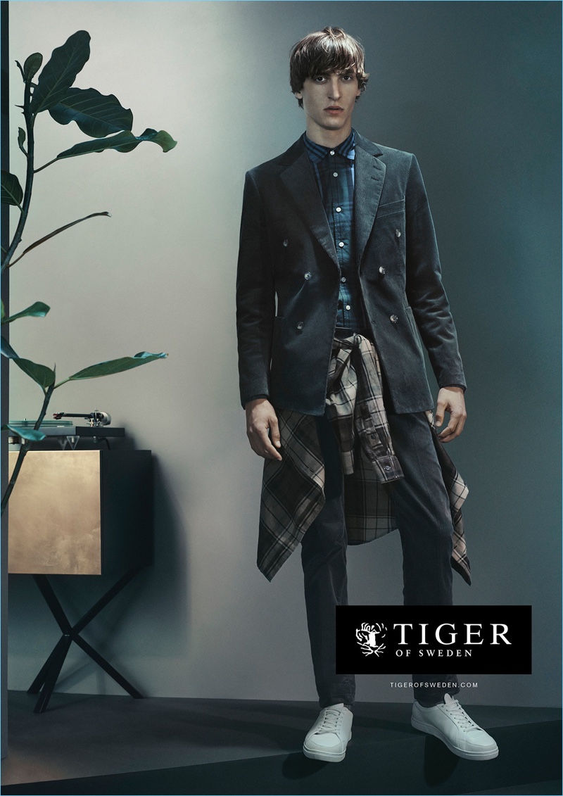 Showing creative layering, Tim Dibble stars in Tiger of Sweden's fall-winter 2017 campaign.