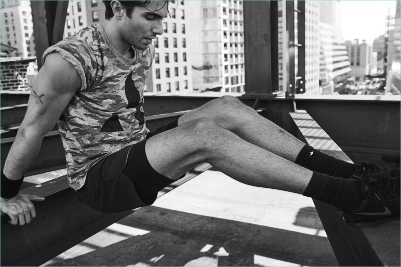 Working out, Akin Akman wears active clothes from his Todd Snyder collaboration.