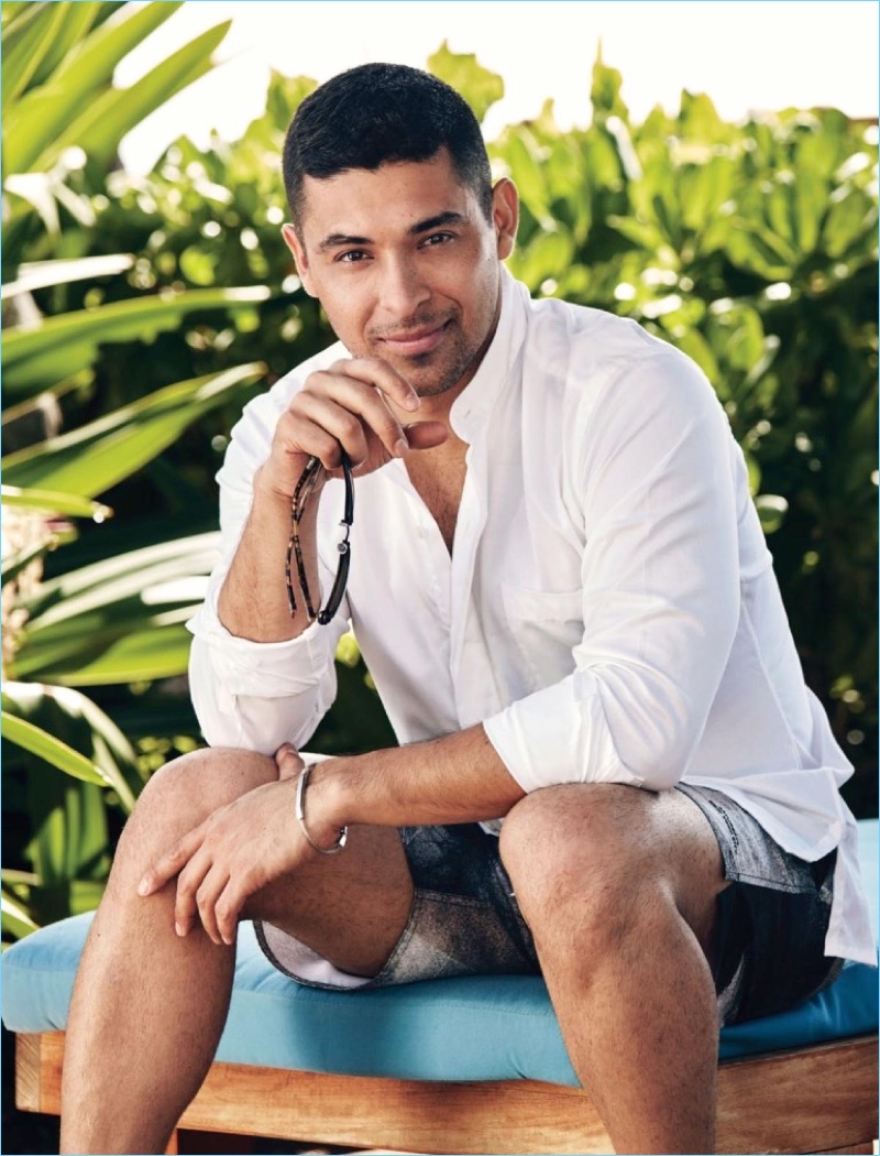 A summer vision, Wilmer Valderrama relaxes in a Palmiers du Mal shirt. He also rocks Saturdays NYC swim shorts.