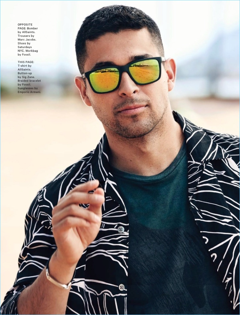 Rocking Emporio Armani sunglasses, Wilmer Valderrama also wears a Sig Zane shirt and AllSaints t-shirt.