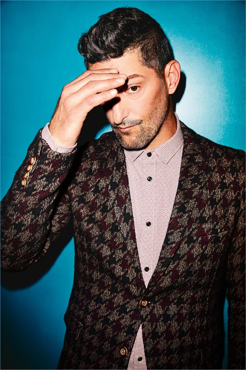 Tony Ward rocks a houndstooth jacket by Mulish with a Scotch & Soda shirt.