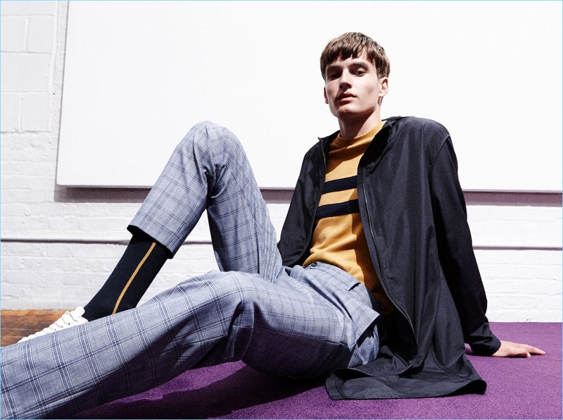 Check trousers come together with a trench coat from Zara Man's sustainable collection.