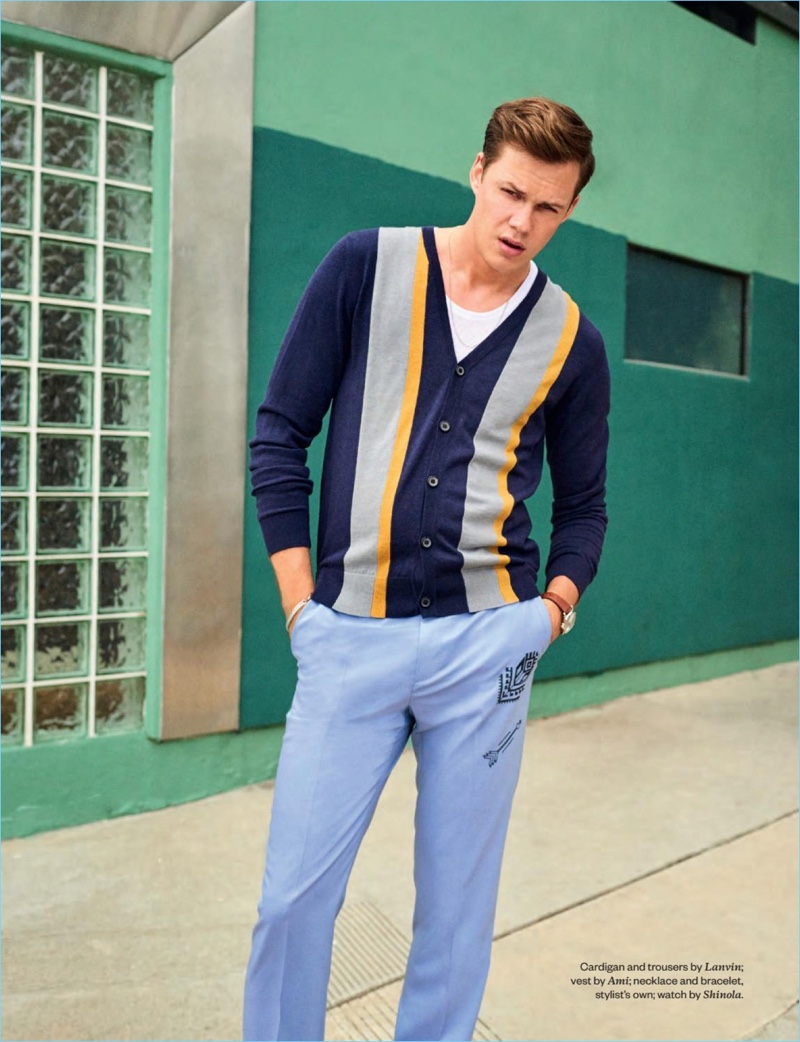 Starring in a photo shoot, Bill Skarsgård dons a Lanvin cardigan and trousers with an AMI tank.