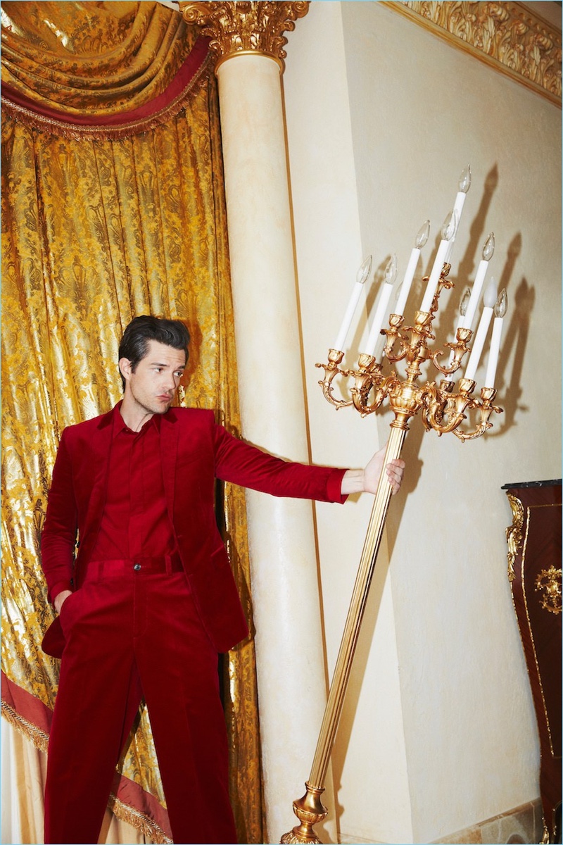 Standing out in red, Brandon Flowers rocks a suit look by Dior Homme.
