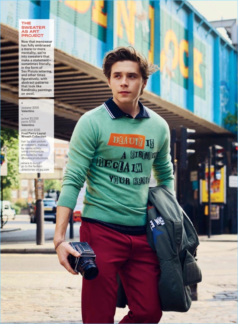 Layering for fall, Brooklyn Beckham wears a Valentino sweater over a Fred Perry polo with Valentino pants.