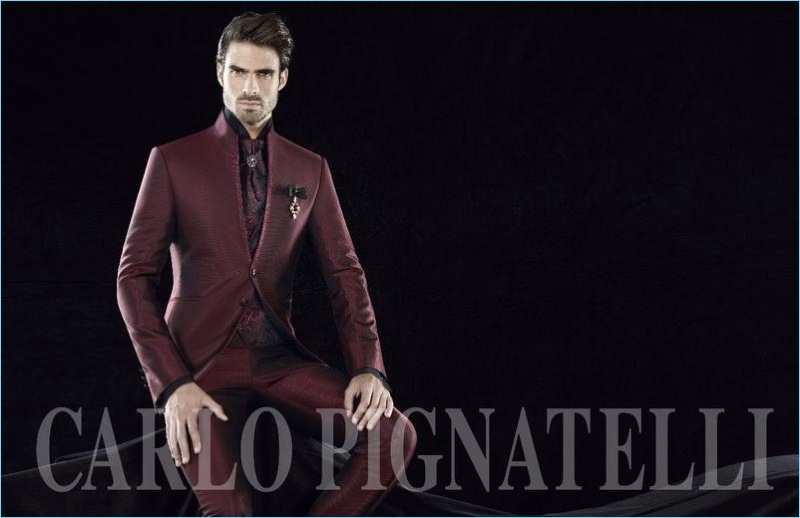 Donning a sartorial burgundy number, Juan Betancourt connects with Carlo Pignatelli Cerimonia.