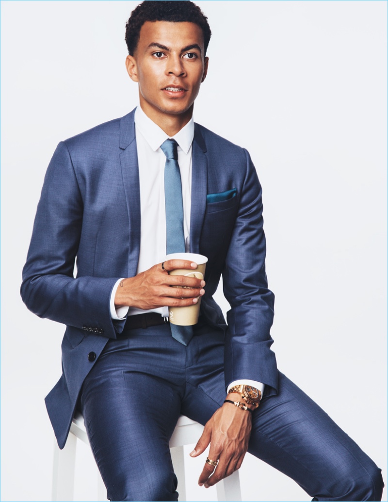 Dele Alli dons a sharp Dior Homme suit, shirt and tie with a Tod's belt for British GQ.