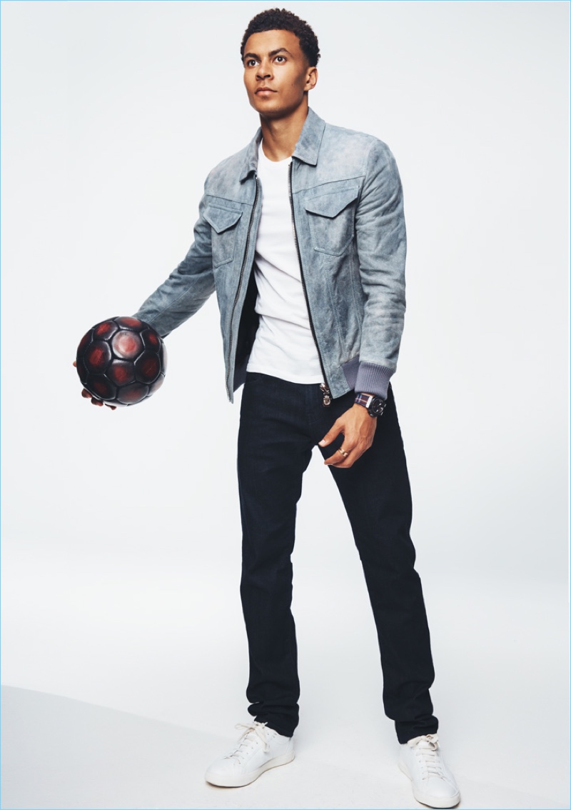 Soccer player Dele Alli wears a Billionaire suede jacket with a Berluti t-shirt and AG jeans.