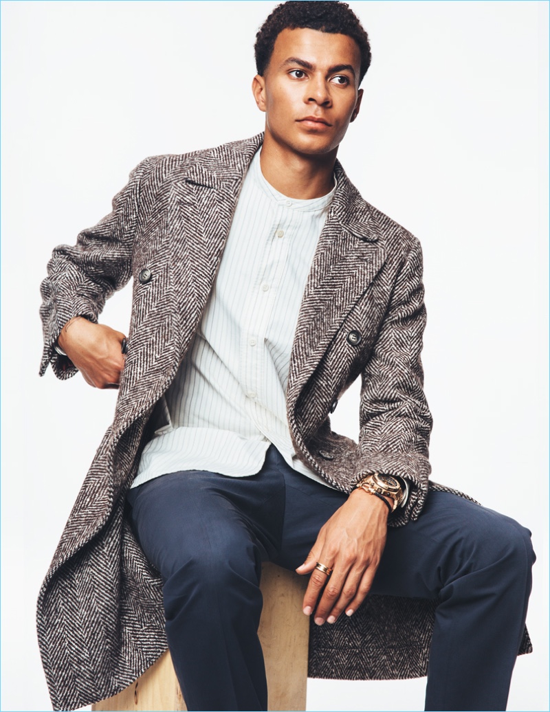 Ready for fall, Dele Alli dons a Brunello Cucinelli coat with a Margaret Howell grandad collar shirt and Lanvin trousers.