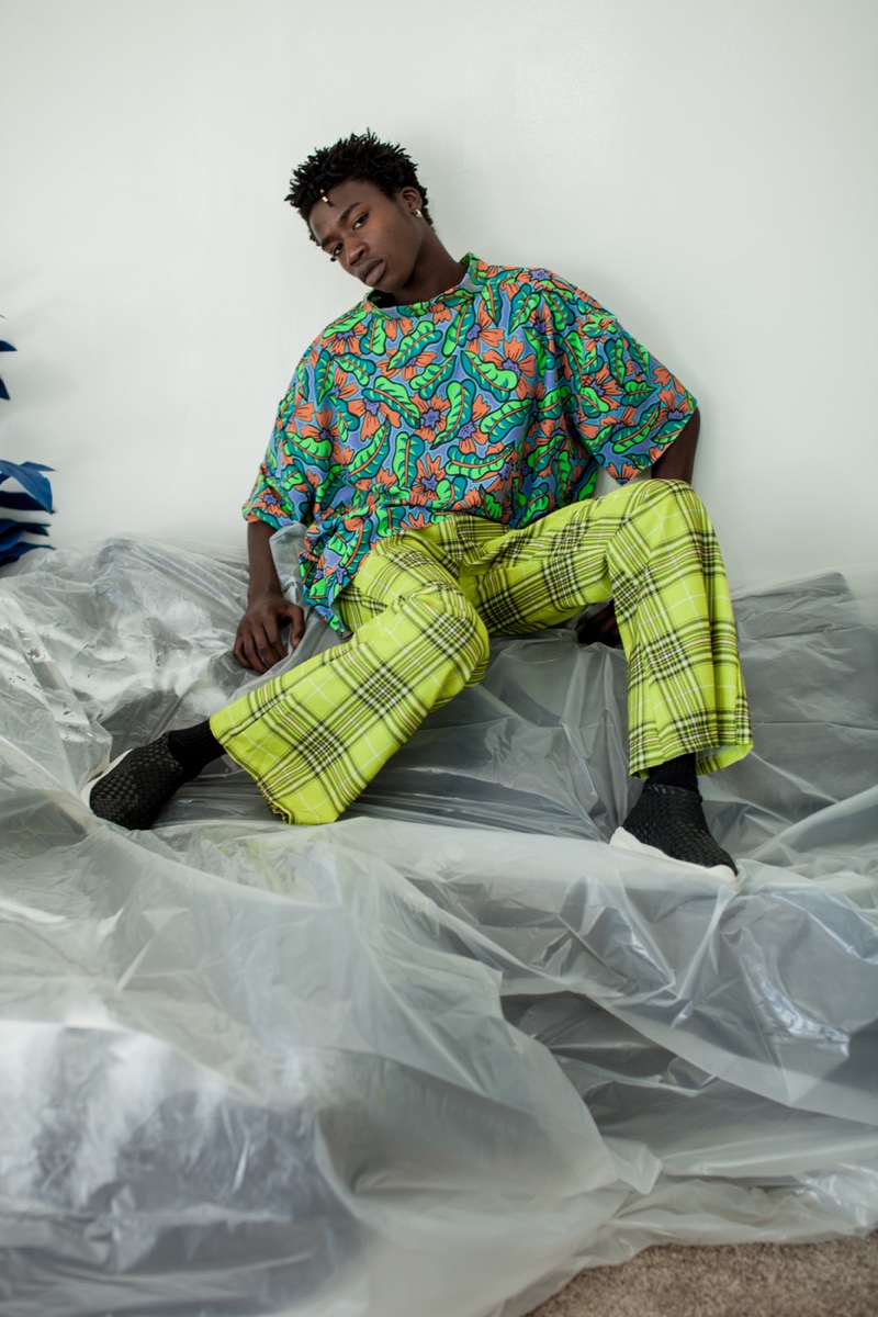 Cheikh wears a vintage top with Ozzie Dots pants and Casbia shoes.