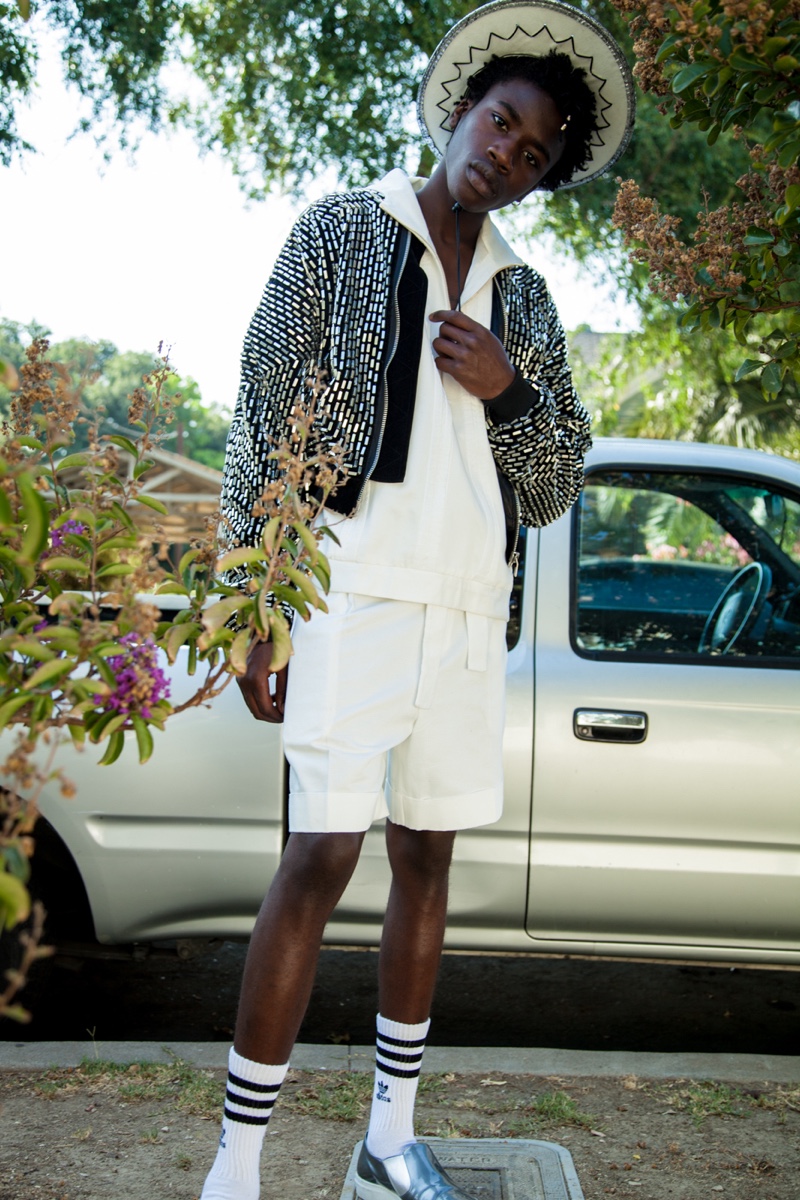 Cheikh wears jacket Heliot Emil, shoes Uri Minkoff, shoes stylist's own, top and shorts Carlos Campos.