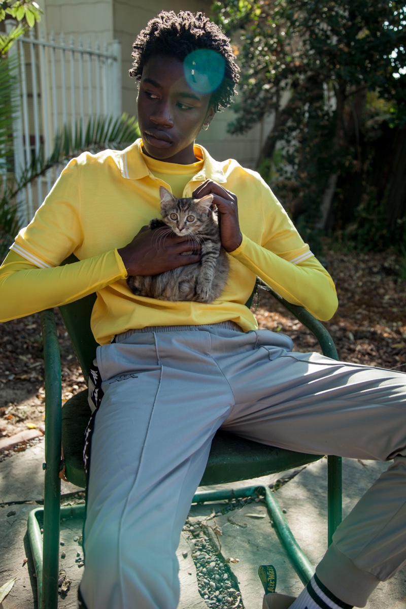 Cheikh wears shirt Salvatore Ferragamo, pants Kappa, and boots Off-White.