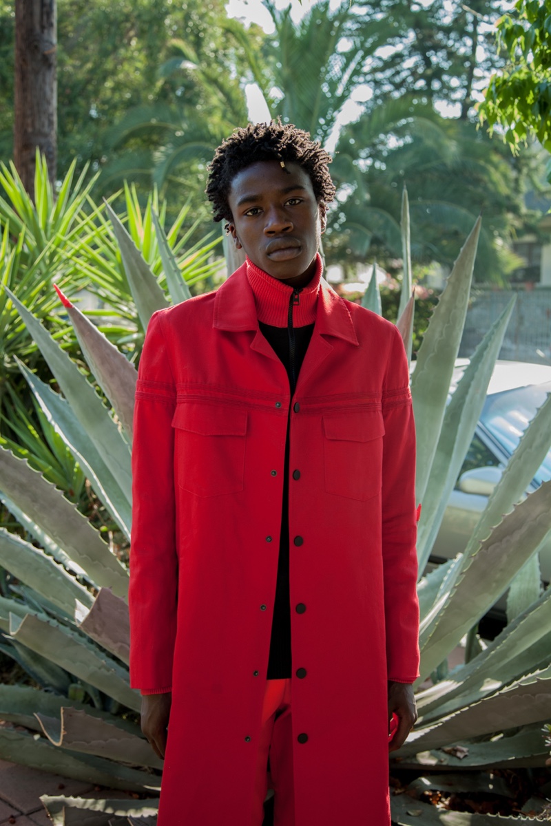 Cheikh wears jacket Carlos Campos and sweater AMI.