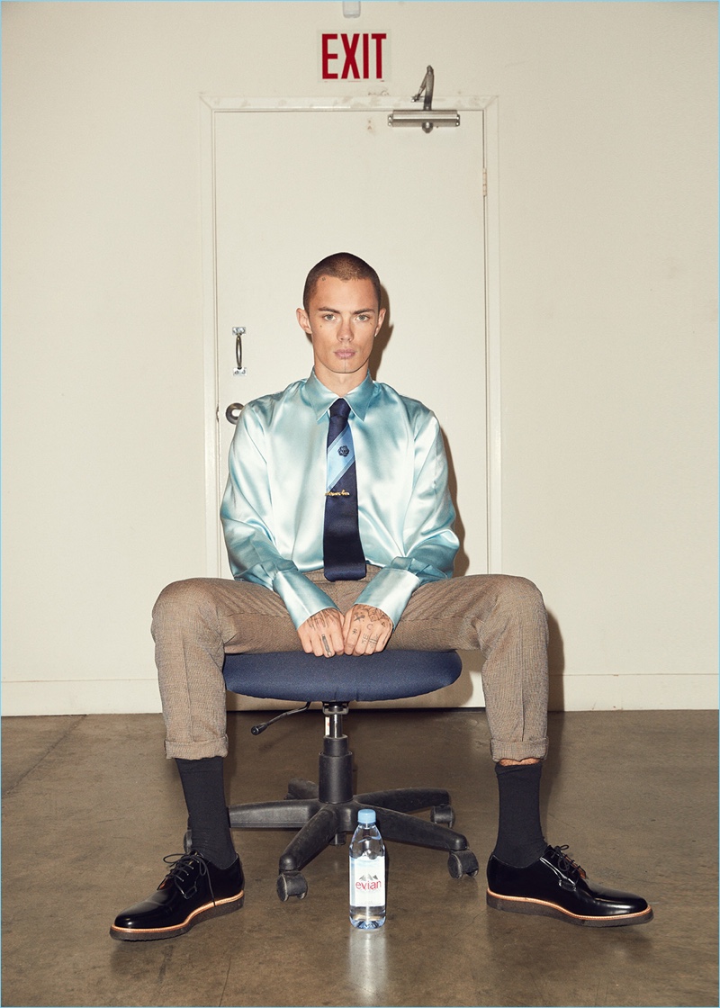 Martine Rose oozes luxury with its double cuff satin shirt. Simon Kotyk wears the covetable item with A.P.C. trousers, Common Projects leather derby shoes, and a Martine Rose tie.