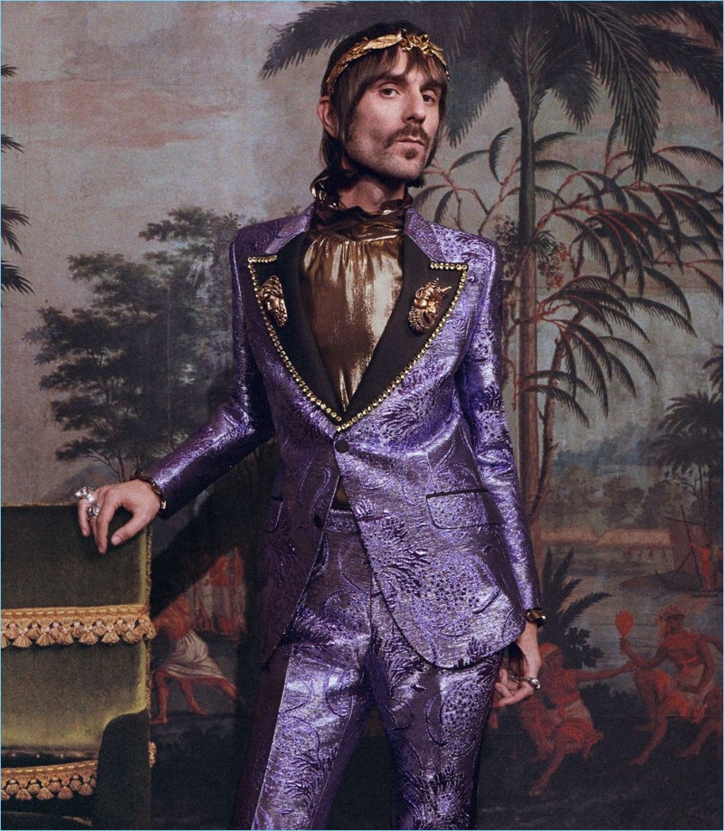 Francesco Bianconi dons a purple suit for Gucci's cruise 2018 campaign.