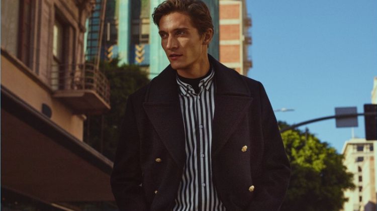 Matvey Lykov dons a peacoat with a striped shirt for H&M's fall 2017 campaign.
