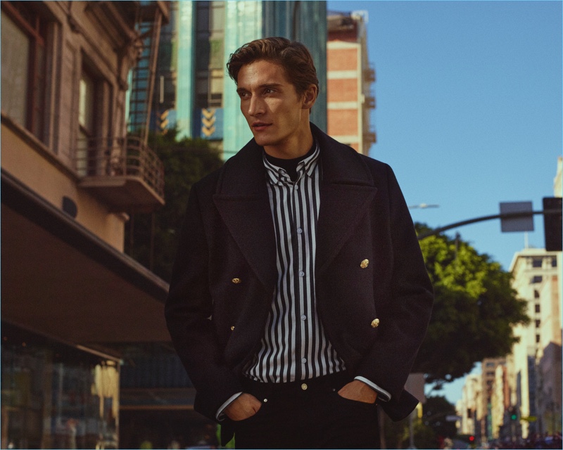 Matvey Lykov dons a peacoat with a striped shirt for H&M's fall 2017 campaign.