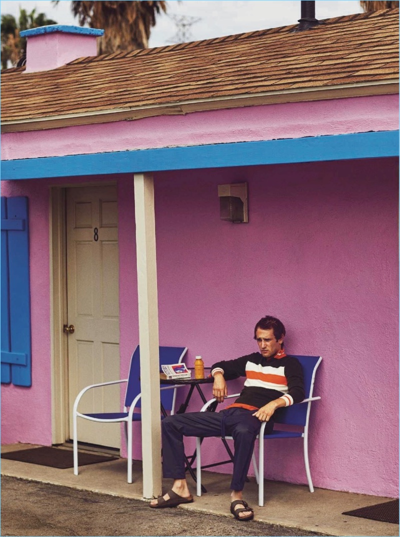 Relaxing, Hopper Penn dons a Fendi track jacket with Dolce & Gabbana joggers and Birkenstocks sandals.